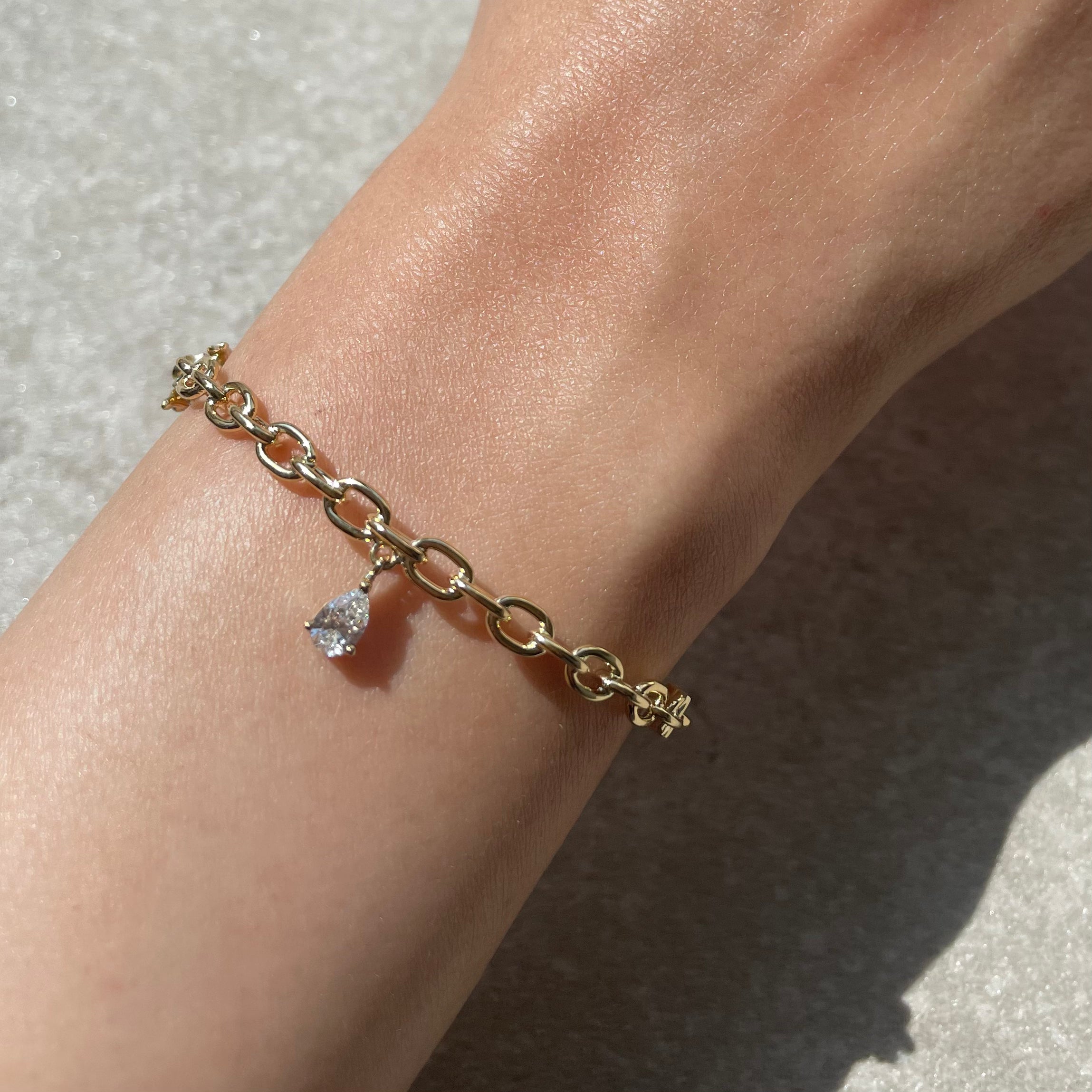 YELLOW GOLD TRAILBLAZER BANGLE WITH PEAR DIAMOND CHARM